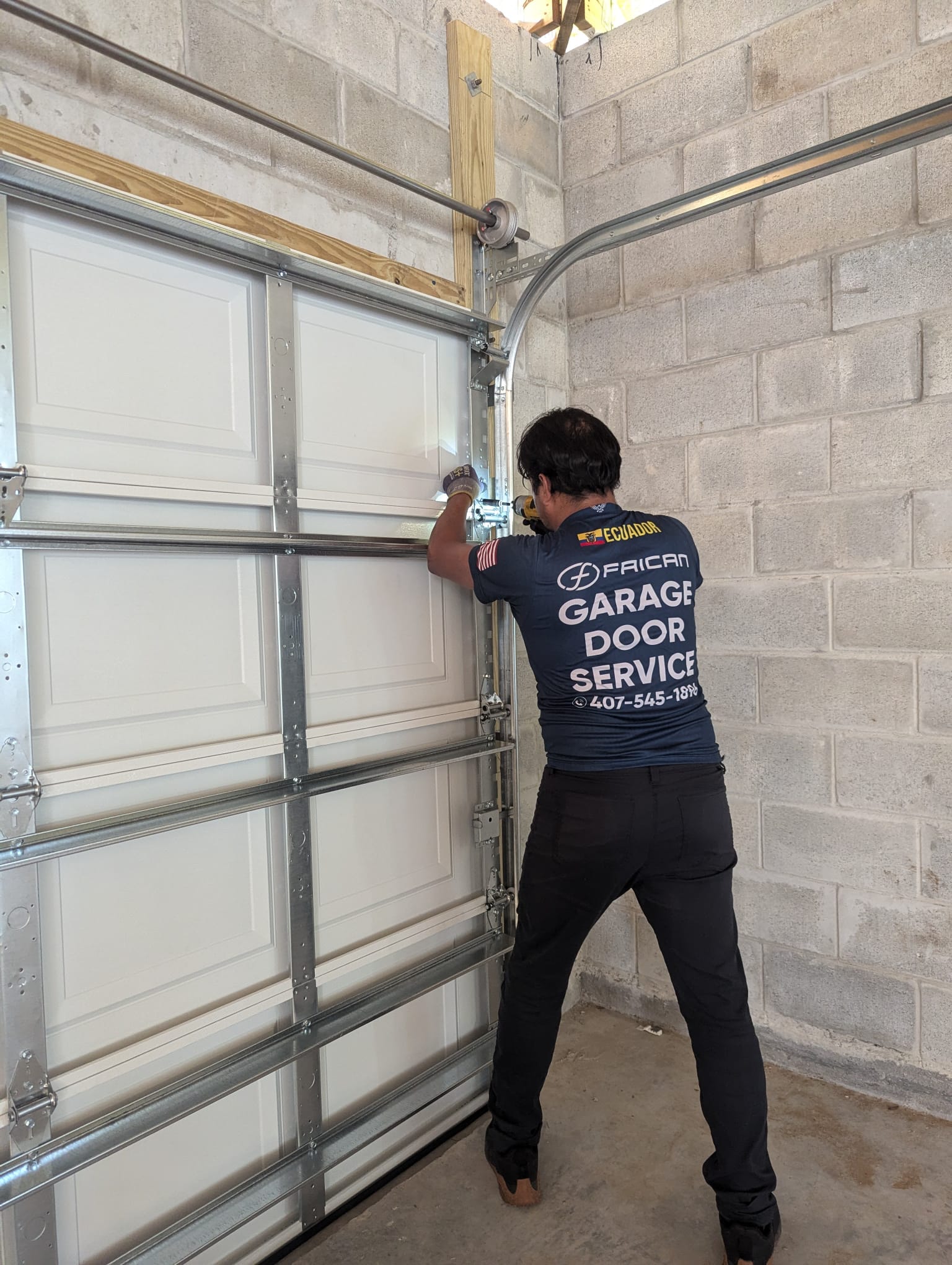 Faican Garage Door technician at work